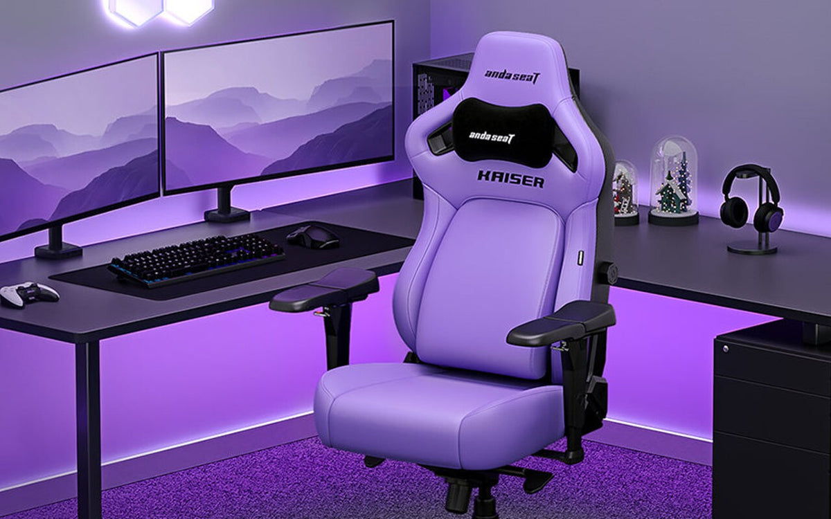 Purple AndaSeat Kaiser 4 gaming chair in a dual-monitor gaming setup