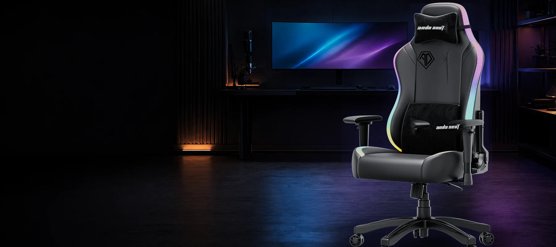 Black AndaSeat Luna RGB gaming chair with multicolour edge lighting in a dark gaming setup